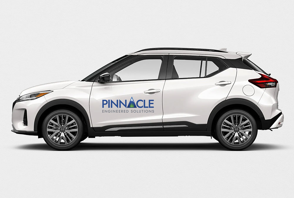 Pinnacle logo on the side of a white car